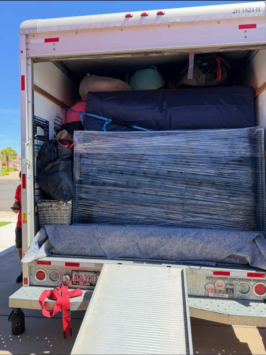 A Top Boss moving truck loaded and strapped for a long haul